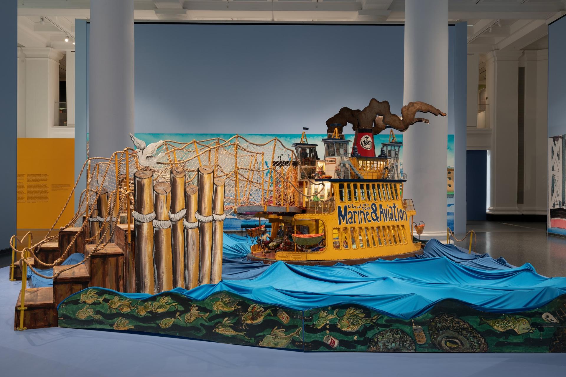 Installation view of <i>Red Grooms, Mimi Gross, and The Ruckus Construction Co.: Excerpts from “Ruckus Manhattan.”</i> Brooklyn Museum, June 13–November 2, 2025. © Red Grooms, Member of Artists Rights Society (ARS). © 2025 Mimi Gross / Artists Rights Society (ARS), New York. (Photo: Paula Abreu Pita)
